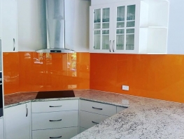 Stunning Sunrise Orange Colourback Glass Kitchen Splashback by Graphic Glass Services Qld