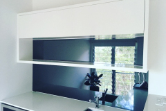 Grey Toughened Mirror Glass Kitchen Splashback by Graphic Glass Services Qld