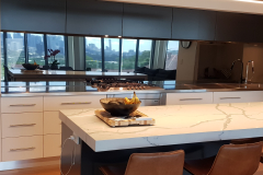 Grey Tint Toughened Mirror Splashback by Graphic Glass Services Qld