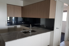 Grey Tint Toughened Mirror Splashback by Graphic Glass Services Qld