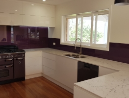 Colourback Glass Splashback in Dulux Punchit Purple  by Graphic Glass Services Qld