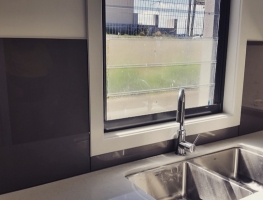 Bronze Metallic Colourback Glass Splashback by Graphic Glass Services Qld