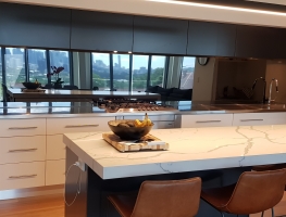 Grey Tint Toughened Mirror Splashback by Graphic Glass Services Qld