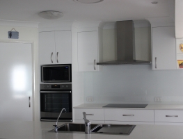 Colourback Glass Splashback in White 101 by Graphic Glass Services Qld