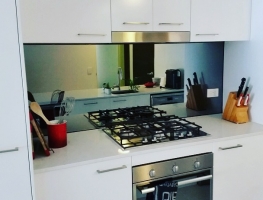 Grey Toughened Mirror Kitchen Splashback by Graphic Glass Services Qld