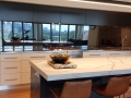 Grey Tint Toughened Mirror Splashback by Graphic Glass Services Qld