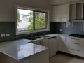 Colour Backed Glass Kitchen Splashback in Satin Silver by Graphic Glass Services Qld