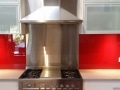 Red Glass Splashback teamed with Frosted Glass Door Inserts by Graphic Glass Services