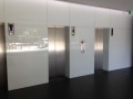 Lift Foyer Colourback Glass Wall Cladding by Graphic Glass Services Qld